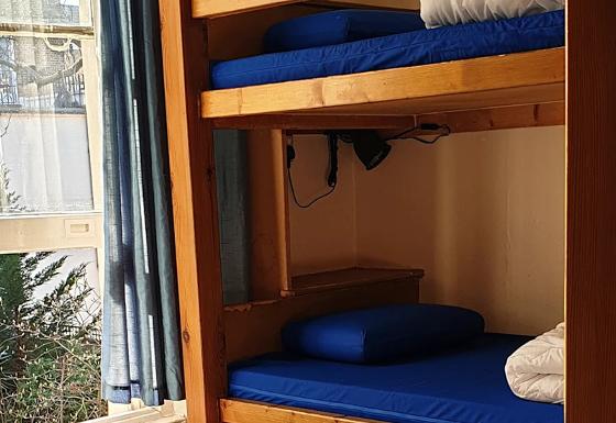 cozy bedroom with floral bedding bright sunlight coming through window
